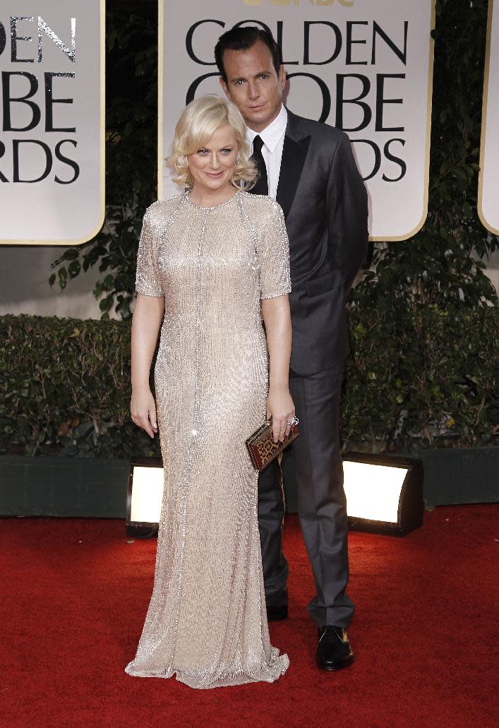 FILE - This Jan. 15, 2012 file photo shows actors Amy Poehler, left, and Will Arnett arriving at the 69th Annual Golden Globe Awards in Los Angeles. Arnett filed for divorce from Poehler on April 8, 2014, in Los Angeles Superior Court more than 18 months after the pair announced they were separating and ending their nine-year marriage. (AP Photo/Matt Sayles, file)