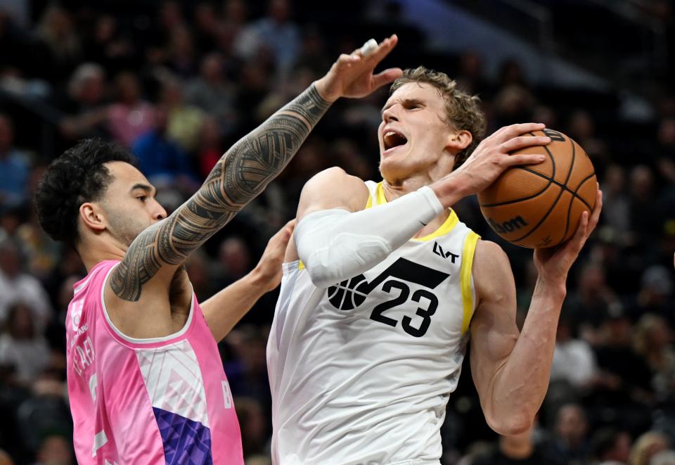 Utah Jazz forward <a class="link " href="https://sports.yahoo.com/nba/players/5769" data-i13n="sec:content-canvas;subsec:anchor_text;elm:context_link" data-ylk="slk:Lauri Markkanen;sec:content-canvas;subsec:anchor_text;elm:context_link;itc:0">Lauri Markkanen</a> (23) is guarded by Breakers’ Izayah Le’ Afa as the Utah Jazz and the New Zealand Breakers play at the Delta Center in Salt Lake City on Monday, Oct. 16, 2023. | Scott G Winterton, Deseret News