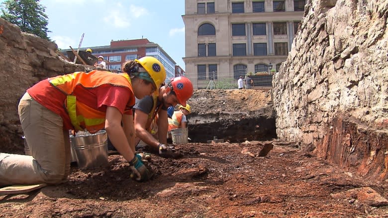Archeological dig at Montreal's pre-Confederation Parliament yields handstamps, charred books