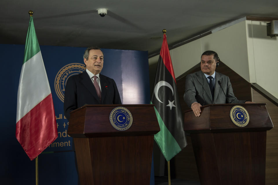 Abdul Hamid Dbeibeh, the Prime Minister of the Government of National Unity, right, and Mario Draghi, the Prime Minister of Italy, speak to media, Tuesday, April, 6 2021 in Tripoli, Libya. (AP Photo/Nada Harib)