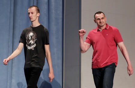 Ukrainian filmmaker Oleg Sentsov and activist Oleksandr Kolchenko arrive for a news conference in Kiev