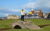 Nick Faldo of England poses on The Swilcan Bridge on the 18th hole during the second round of the British Open golf championship on the Old Course in St. Andrews, Scotland, July 17, 2015. Faldo is playing in his last Open golf championship at St. Andrews. REUTERS/Eddie Keogh