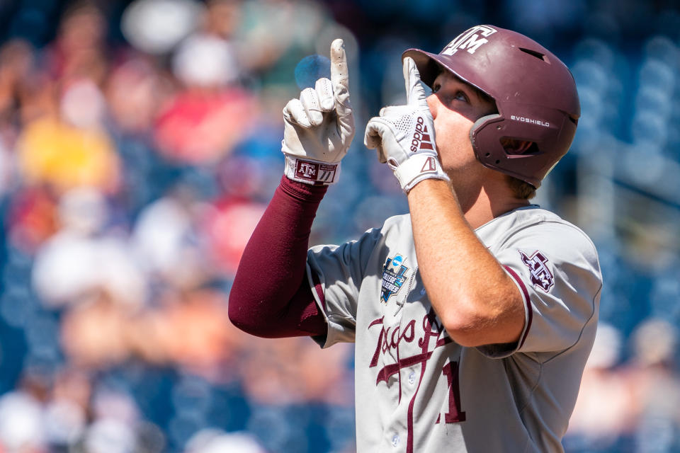 Jun 22, 2022; Omaha, NE; Texas A&M Aggies designated hitter Austin Bost (11) reacts after hitting a single against the Oklahoma Sooners during the ninth inning at Charles Schwab Field. Dylan Widger-USA TODAY Sports