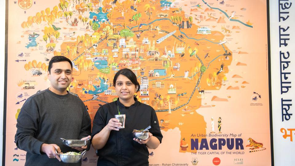 Neeraj Sagdeo, left, and his wife Swapna Sagdeo, co-owners of Nagpuri Saoji, stand by a map of Nagpur that is displayed in the dining room of their Voorhees restaurant. Nagpuri Saoji is the only restaurant in the United States that serves Saoji cuisine.  Saoji is a cuisine invented by the weaver community of Nagpur, a city in the central Indian state of Maharashtra.  