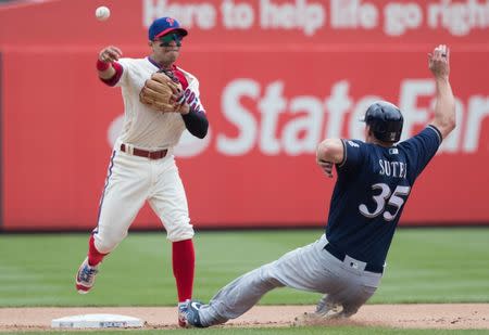 Jun 9, 2018; Philadelphia, PA, USA; Philadelphia Phillies second baseman Cesar Hernandez (16) tags out Milwaukee Brewers relief pitcher Brent Suter (35) on a fielders choice during the fifth inning at Citizens Bank Park. Mandatory Credit: Bill Streicher-USA TODAY Sports