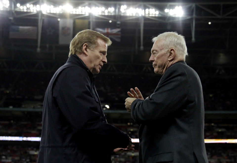 Not so fast: According to an ESPN report, Dallas owner Jerry Jones, right, is impeding contract talks with NFL commissioner Roger Goodell. (AP)