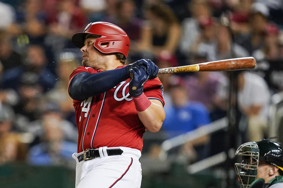 Washington Nationals first baseman Luke Voit watches his two-run homer during the fifth inning of a baseball game against the Oakland Athletics at Nationals Park, Wednesday, Aug. 31, 2022, in Washington. (AP Photo/Alex Brandon)