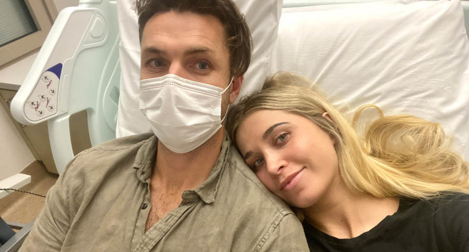 Hannah and Simon Thomas in hospital bed. 