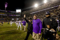 LSU head coach Ed Orgeron , second from right, celebrates after a win against Texas A&M in an NCAA college football game in Baton Rouge, La., Saturday, Nov. 27, 2021. (AP Photo/Derick Hingle)