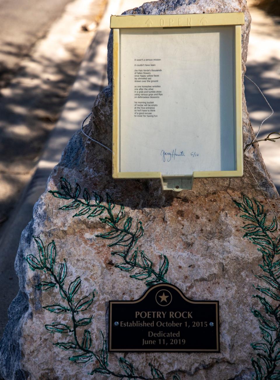 Local poet Gary Hunter’s Poetry Rock is seen with his poem of the day posted outside of his home in Palm Springs, Calif., Thursday, May 12, 2022.