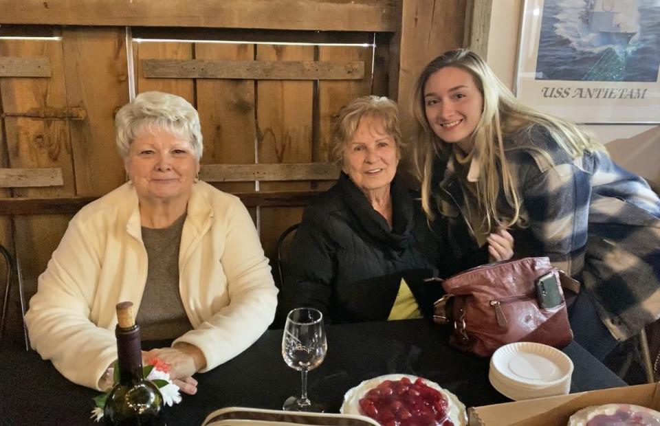 Esther Wolfensberger, center, poses for a picture during dinner out with her stepdaughter, Debbie Conrad, left, and granddaughter Hollee Winders.