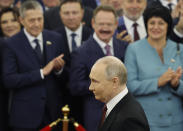 Vladimir Putin walks to take his oath as Russian president during an inauguration ceremony in the Grand Kremlin Palace in Moscow, Russia, Tuesday, May 7, 2024. (Maxim Shemetov/Pool Photo via AP)
