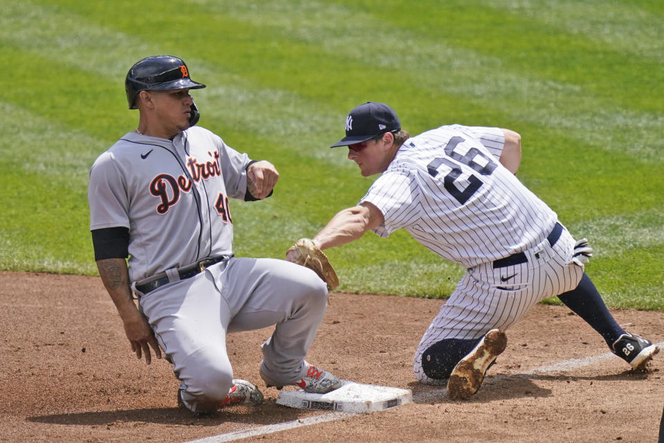 Detroit Tigers' Wilson Ramos, left, slides safely into third past New York Yankees third baseman DJ LeMahieu during the third inning of a baseball game at Yankee Stadium, Sunday, May 2, 2021, in New York. (AP Photo/Seth Wenig)