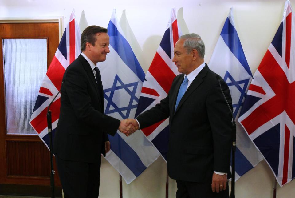 British Prime Minister David Cameron, left, shakes hands with his Israeli counterpart Benjamin Netanyahu after delivering joint statements in Jerusalem on Wednesday, March 12, 2014. Cameron made his first visit as British leader to Israel and plans to visit the Palestinian territories this week. (AP Photo/Ronen Zvulun, Pool)