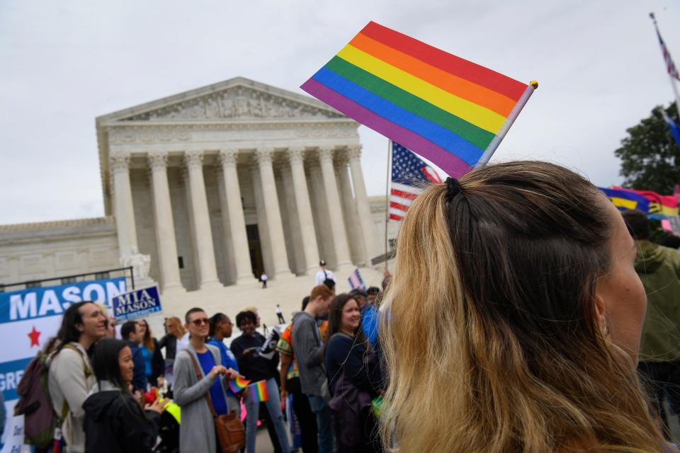 Demonstrators gather in front of the Supreme Court in October 2019 as the justices hear challenges involving workers who claimed they were fired for being gay or transgender.