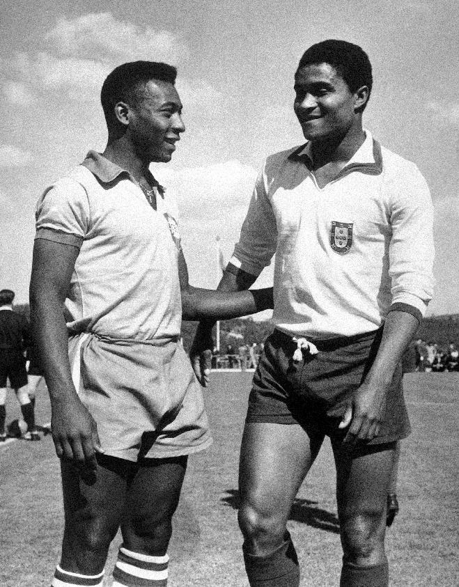 FILE - In this April 27, 1963 file photo, Brazilian footballer Edson Arantes do Nascimento, known as Pele, left, enjoys a chat with Eusebio da Silva Ferreira in Lisbon, Portugal. Eusebio, the Portuguese football star who was born into poverty in Africa but became an international sporting icon and was voted one of the 10 best players of all time, has died of heart failure aged 71, Sunday, Jan. 5 2014. (AP Photo, File)