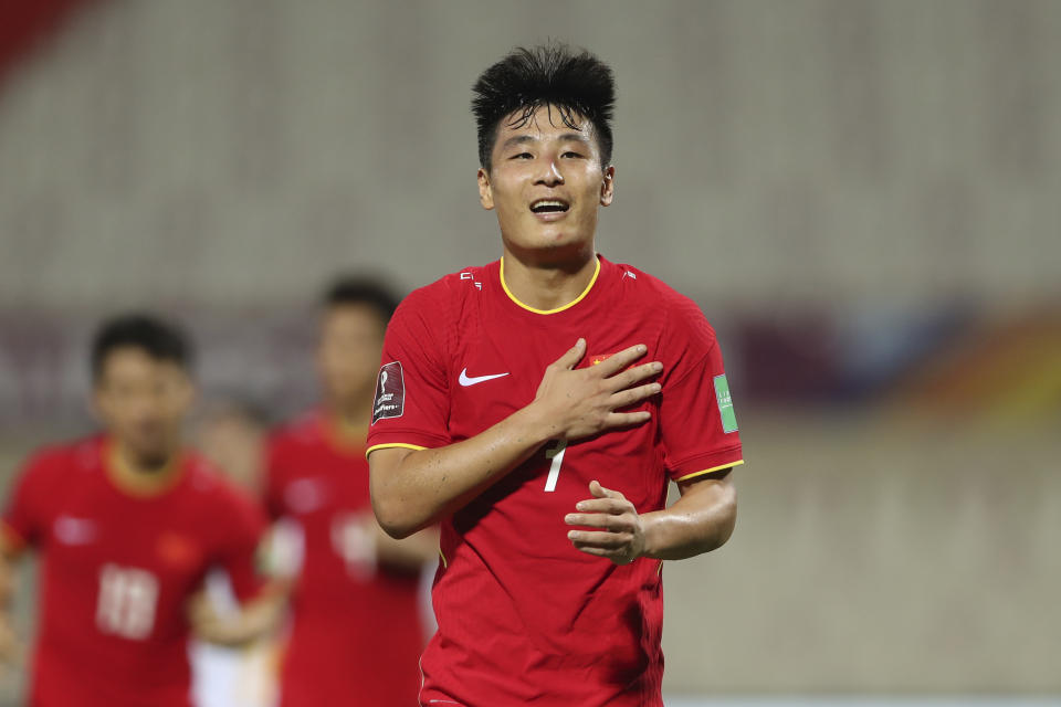 FILE - China's Lei Wu celebrates after scoring his side's second goal during the World Cup 2022 group B qualifying soccer match between China and Vietnam at Sharjah stadium in Sharjah, United Arab Emirates, Thursday, Oct. 7, 2021. China is missing out on the World Cup again despite spending millions — probably billions — to develop the game, a reported priority of Xi Jinping, the all-powerful general secretary of the Chinese Communist Party. (AP Photo/Kamran Jebreili, File)