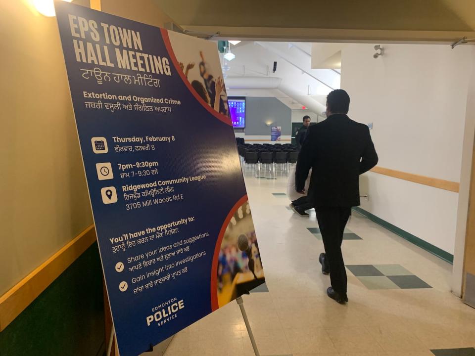 Attendees packed the Ridgewood Community League on Feb. 8, 2024, to hear an update from police on extortion, arson and drive-by shootings targeting South Asian home builders in Edmonton. (Madeline Smith/CBC - image credit)