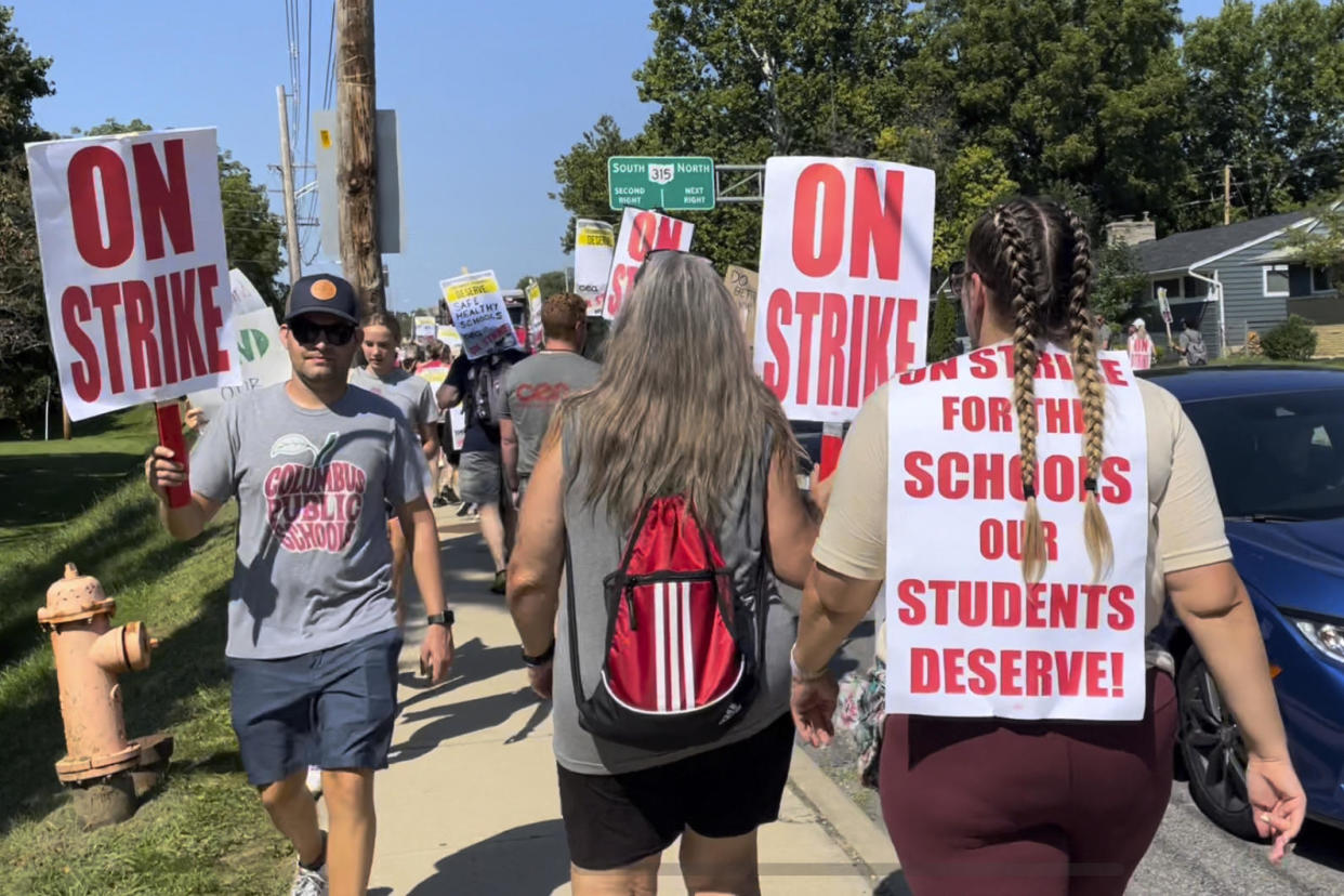 Union members picket during a district-wide teachers strike outside Whetstone High School in Columbus, Ohio, on August 22, 2022. / Credit: Samantha Hendrickson / AP