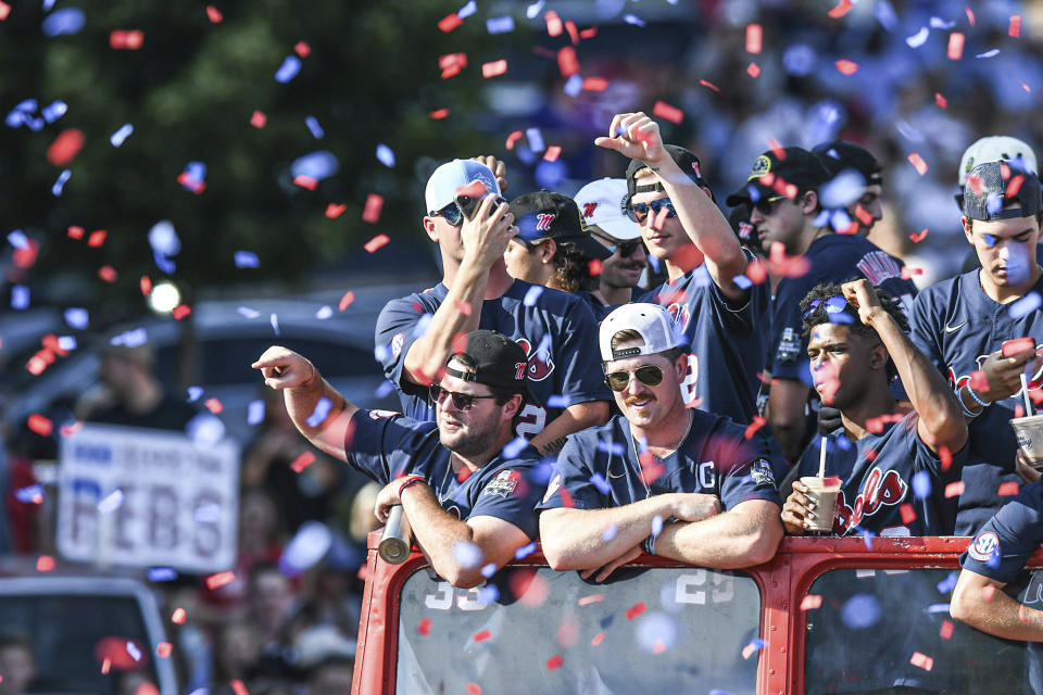 FILE - Mississippi baseball players celebrate its College World Series national championship in a parade in Oxford, Miss. on June 29, 2022. Mississippi is the defending national champion and returns star shortstop Jacob Gonzalez and many of the pitchers who appeared in the College World Series. (AP Photo/Bruce Newman, File)