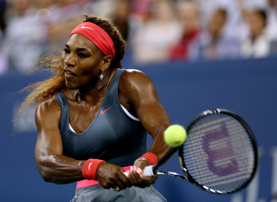 NEW YORK, NY - AUGUST 26:  Serena Williams of the United States of America plays a backhand against Francesca Schiavone of Italy during their women's singles first round match on Day One of the 2013 US Open at USTA Billie Jean King National Tennis Center on August 26, 2013 in the Flushing neighborhood of the Queens borough of New York City.  (Photo by Matthew Stockman/Getty Images)