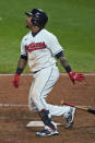 Cleveland Indians' Jose Ramirez watches his two-run double during the seventh inning of the team's baseball game against the Chicago White Sox, Thursday, Sept. 24, 2020, in Cleveland. (AP Photo/Tony Dejak)