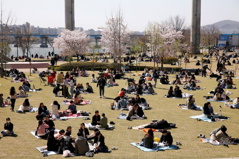 People enjoy a picnic at a Han River Park following the outbreak of the coronavirus disease (COVID-19), in Seoul