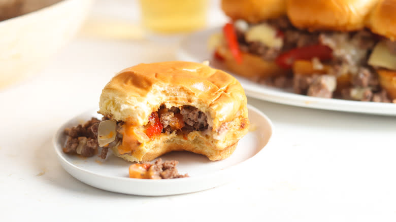 philly cheesesteak sloppy joe slider with bite on plate