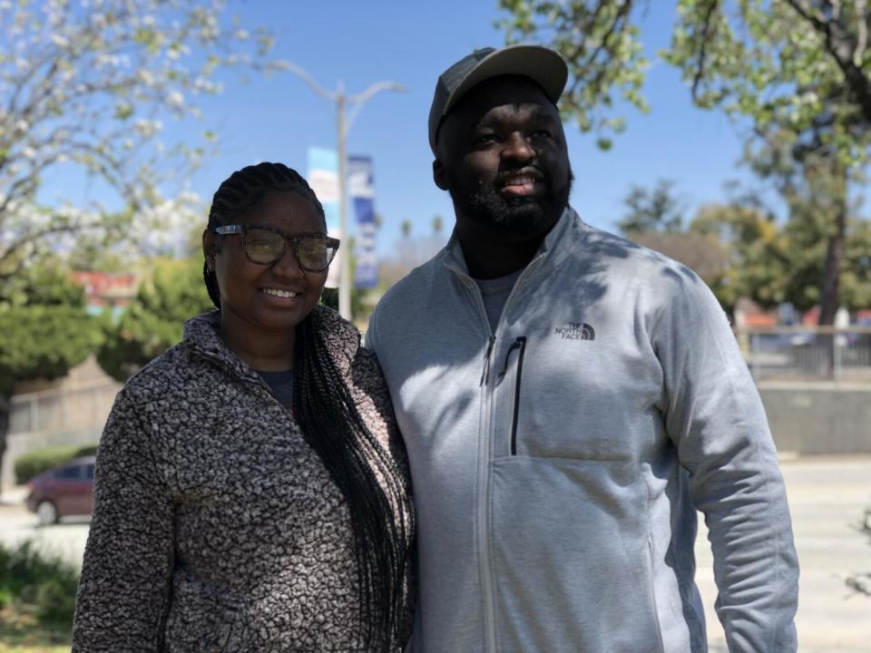 Paige Weathersby and Kevin Jones pose in the downtown area of Pomona.