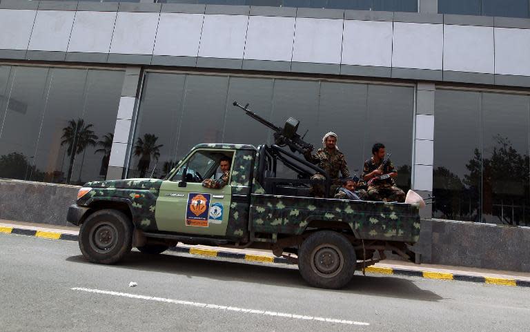 Armed members of the Shiite Huthi militia patrol the Sanaa International Airport in Sanaa, on March 28, 2015