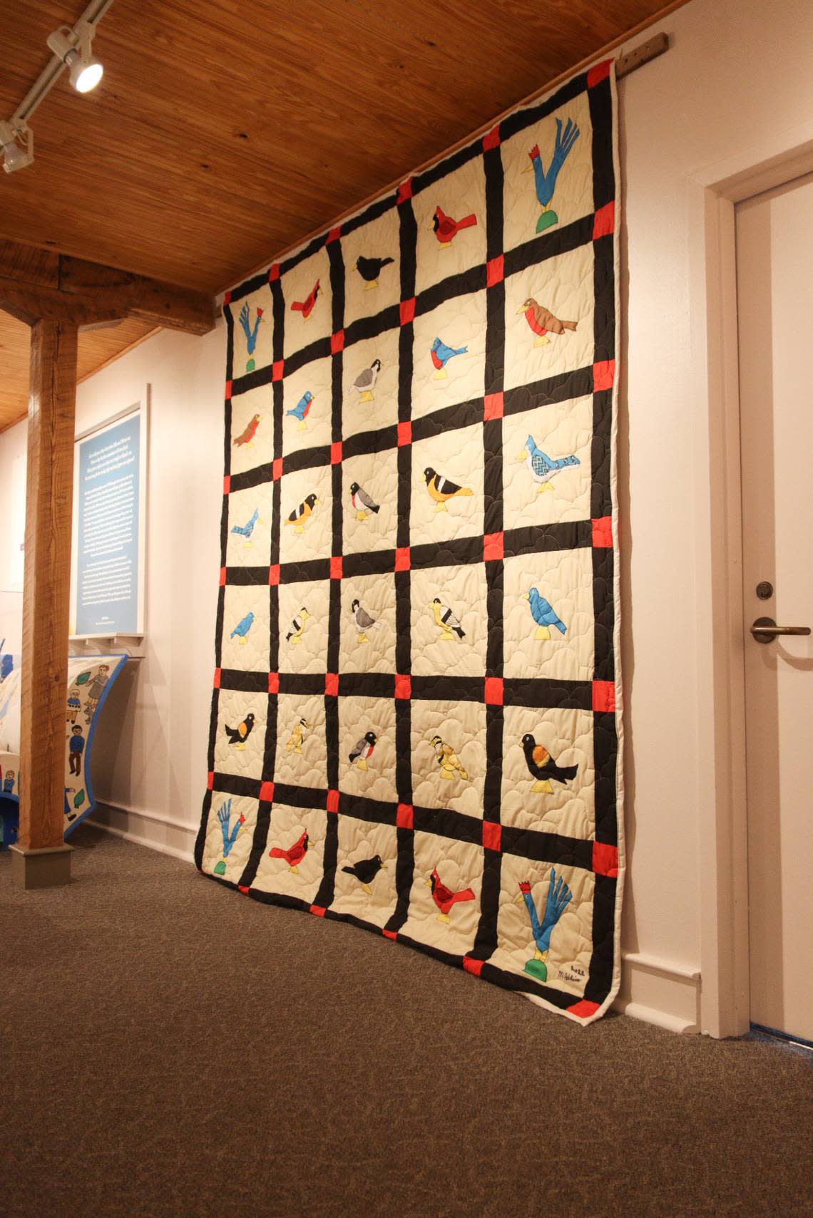 The Minnie Adkins exhibit includes a hand-made quilt. Adkins created characters for Mike Norris’ books, including “Bright Blue Rooster,” “Ring Around the Moon” and “Sonny the Monkey.”
