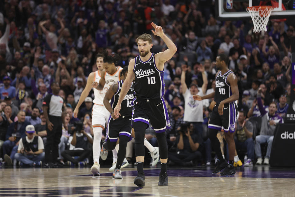 Sacramento Kings forward Domantas Sabonis (10) gestures after scoring against the San Antonio Spurs during the second half of an NBA basketball game Thursday, March 7, 2024, in Sacramento, Calif. (AP Photo/Jed Jacobsohn)