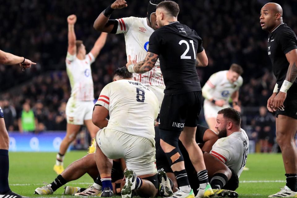 Late show: England scored three tries in a matter of minutes to claim a thrilling draw with New Zealand (PA)