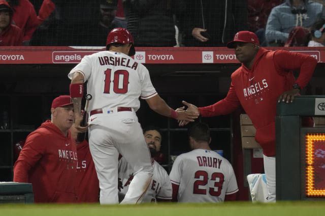 Los Angeles Angels' Gio Urshela (10) hits an RBI single during the