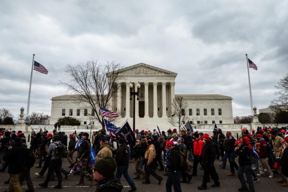 Pro-Trump supporters march in front of the Supreme Court on January 6, 2021 in Washington, DC. A pro-Trump mob stormed the Capitol, breaking windows and clashing with police officers. (Photo by Jon Cherry/Getty Images)