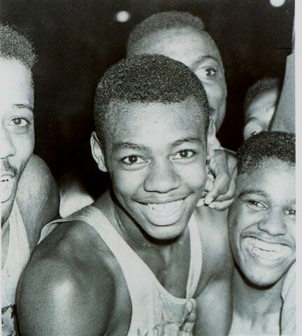 Oscar Robertson and teammates celebrate Crispus Attucks’ state basketball championship in 1955.