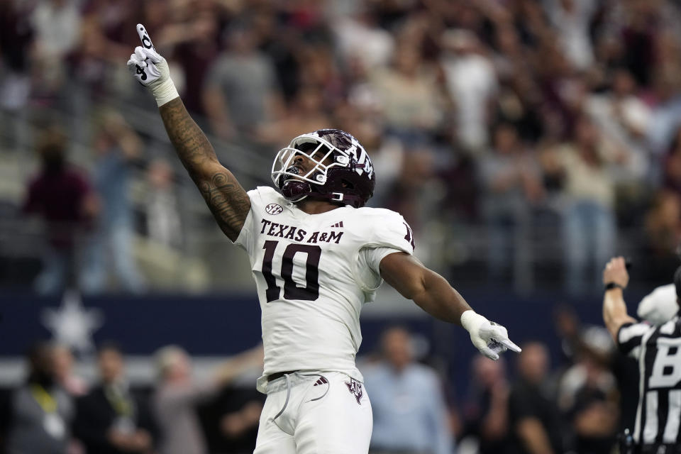 Texas A&M defensive lineman Fadil Diggs (10) celebrates a sack during the second half of an NCAA college football game against Arkansas, Saturday, Sept. 30, 2023, in Arlington, Texas. (AP Photo/LM Otero)