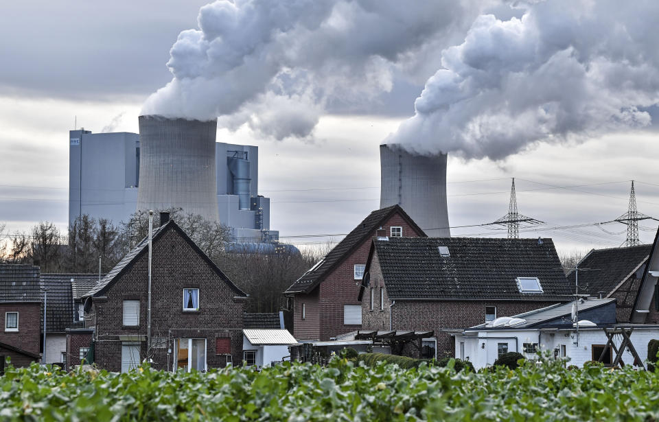 FILE --- In this Monday, Jan. 13, 2020 file photo the RWE lignite-fired power station releases steam in Bergheim, Germany The German government is to agree its national hydrogen strategy for the coming decades, part of a plan to reduce the country's dependence on fossil fuels. (AP Photo/Martin Meissner, file)