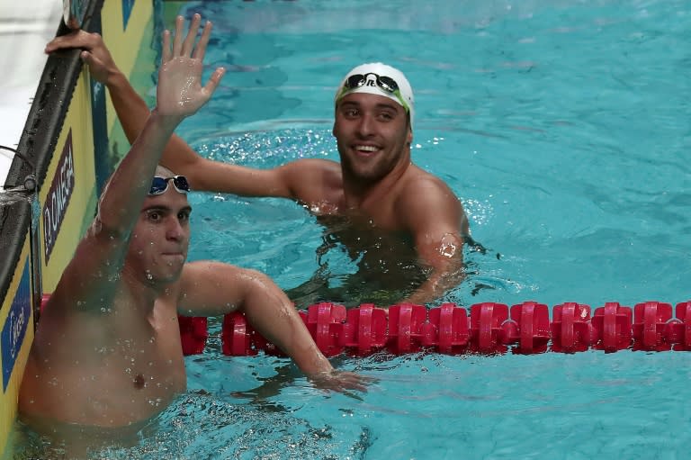 Hungary's Laszlo Cseh (L) and South Africa's Chad Le Clos acknowledge fans after competing in the 200m butterfly semi-final during the 2017 FINA World Championships in Budapest, on July 25