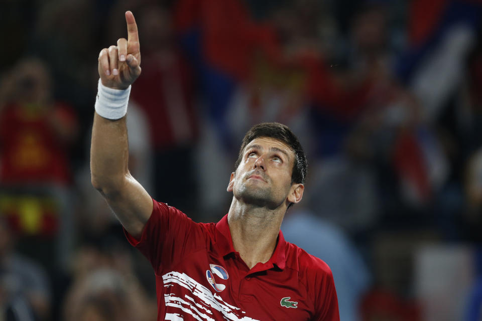 Novak Djovovic of Serbia reacts after winning the match against Rafael Nadal of Spain during their ATP Cup tennis match in Sydney, Sunday, Jan. 12, 2020. (AP Photo/Steve Christo)