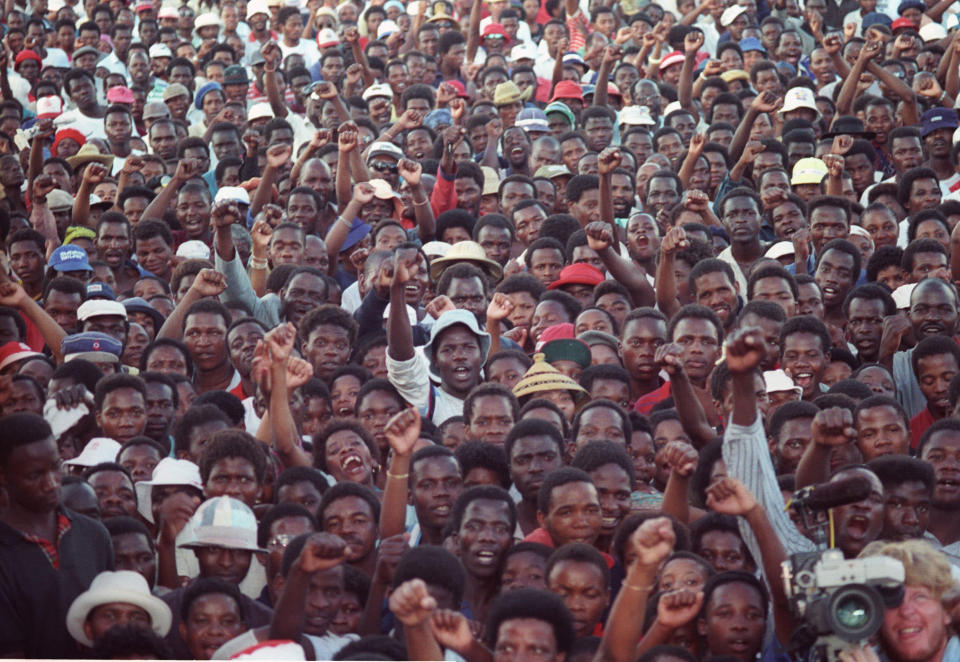 Protestors raise their fists as Winnie Mandela asks them who were in the ANC during a rally of several thousand people in Johannesburg's Alexandra township on February 3, 1990, the first after South African President F.W. de Klerk unbanned the African National Congress (ANC). (Juda Ngwenya / Reuters)