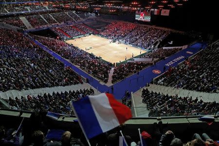 A fan waves a French flag during the first Davis Cup final singles tennis match at the Pierre-Mauroy stadium in Villeneuve d'Ascq, near Lille, November 21, 2014. REUTERS/Pascal Rossignol