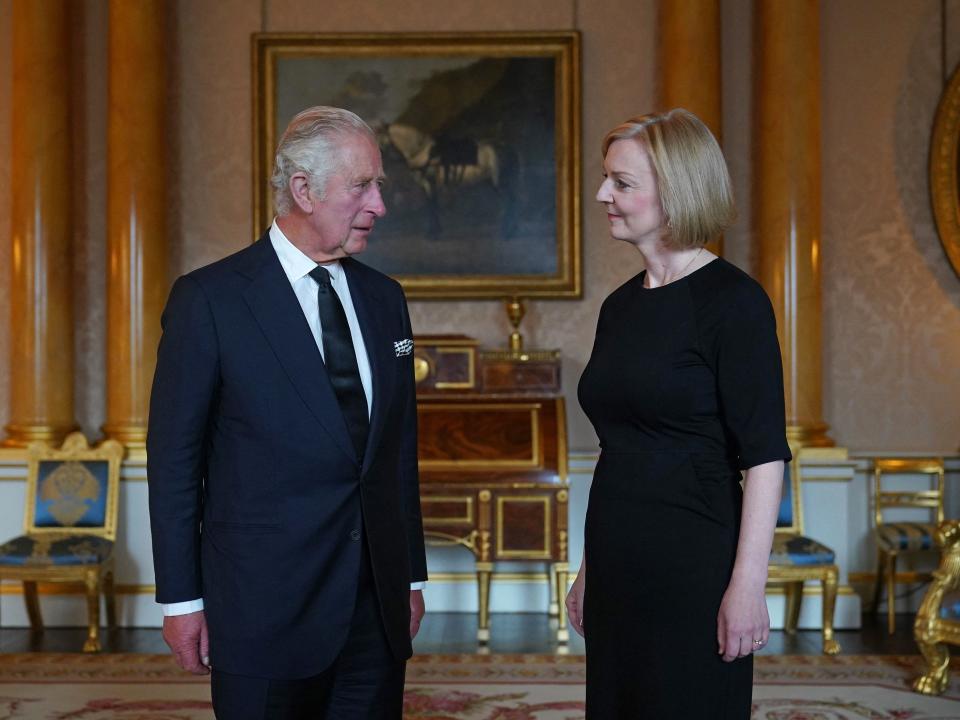 King Charles III (L) speaks with Britain's Prime Minister Liz Truss (R)during their first meeting at Buckingham Palace in London on September 9, 2022