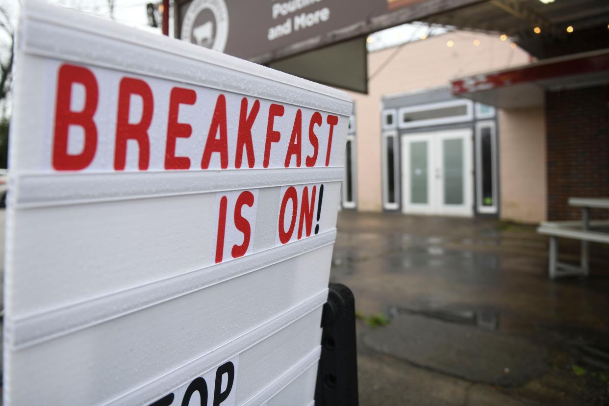 A sign reading "Breakfast is On!" Sits outside Deep South Cheese and Grill in Dearing, Ga., on Monday, Feb. 12, 2024.