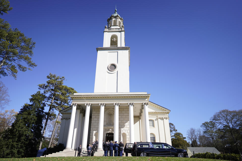 An Armed Force body bearer team prepare to carry the casket of former first lady Rosalynn Carter into the Glenn Memorial Church at Emory University for a service, in Atlanta, Tuesday, Nov. 28, 2023. A gathering of first ladies and presidents — including her 99-year-old husband Jimmy Carter — joined other political figures in tribute. (AP Photo/Mike Stewart)