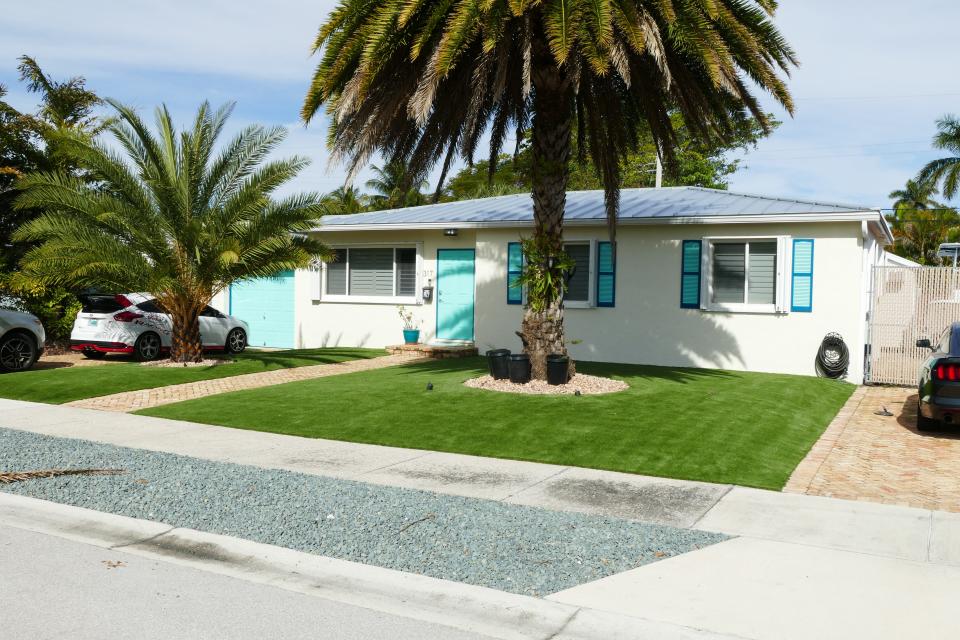 An artificial turf lawn in West Palm Beach that the owner was told by the city he had to remove and replace with grass.
(Credit: Contributed)