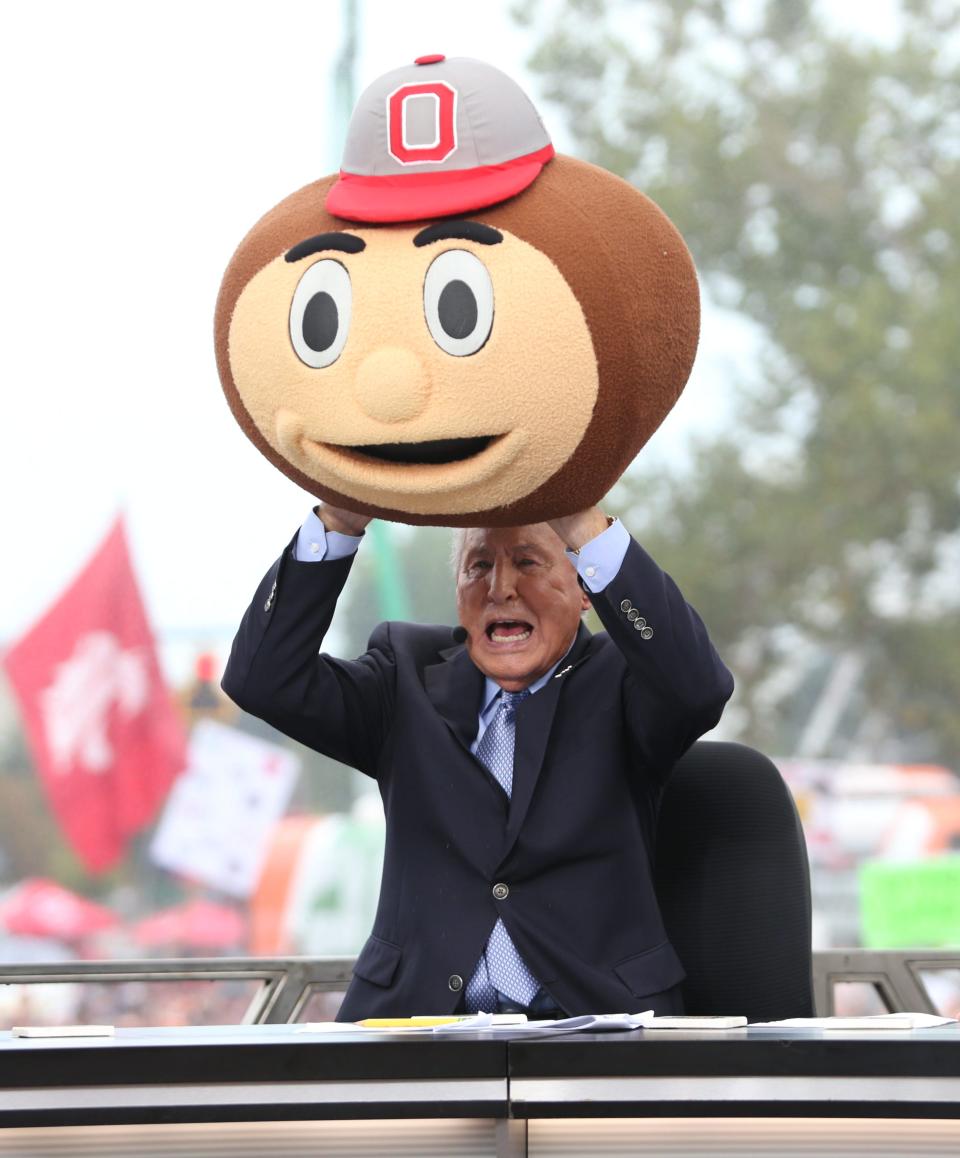 September 3, 2022; Columbus, Ohio, USA; Sports analyst, Lee Corso, puts on the Brutus mascot head to select the Ohio State Buckeye to win over Notre Dame as his GameDay pick during the College GameDay broadcast in Columbus, Ohio on Sept. 3, 2022; Columbus, OH, USA;  Mandatory Credit: Maddie Schroeder/Columbus Dispatch