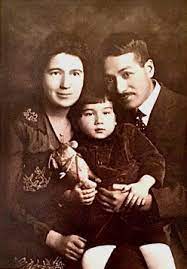 Iwahiko Tsumanuma and his wife, Agnes, take a portrait with their son, George Thomas Rockrise, circa 1917 in New York.