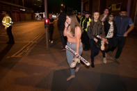 <p>Concert goers react after fleeing the Manchester Arena in northern England where U.S. singer Ariana Grande had been performing in Manchester, Britain, May 22, 2017. (Jon Super/Reuters) </p>