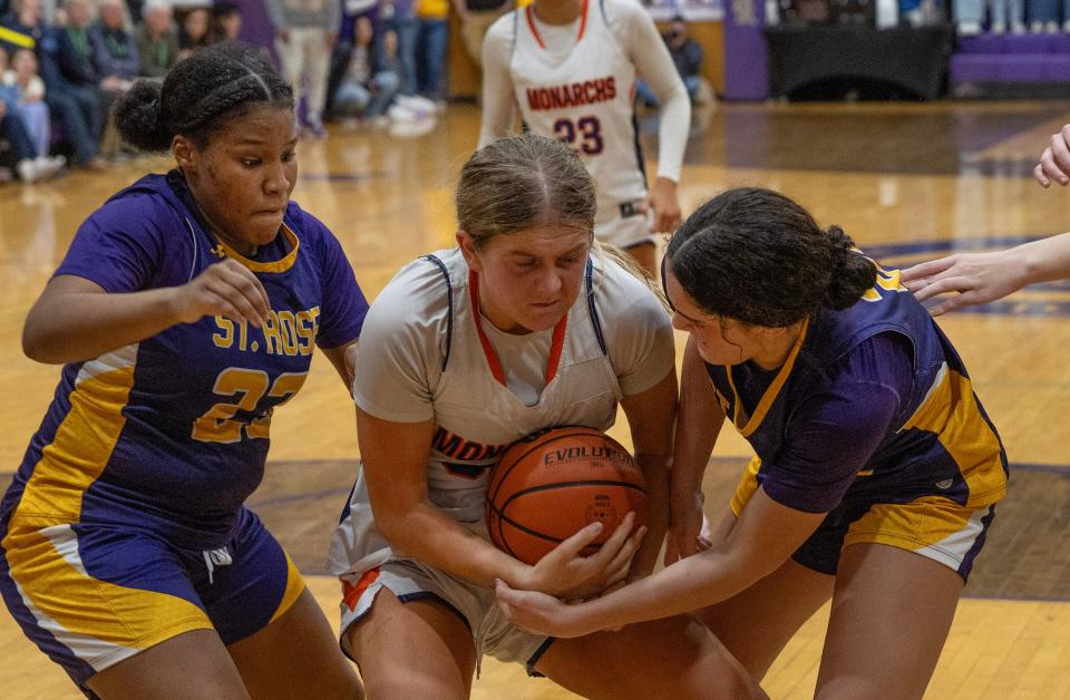 Hall’s Lilly Riggi battles with Taniyah Decker and Cassidy Kruesi for a rebound. St Rose Girls basketball defeats Trinity Hall in overtime in Belmar, NJ, on January 26, 2024.
